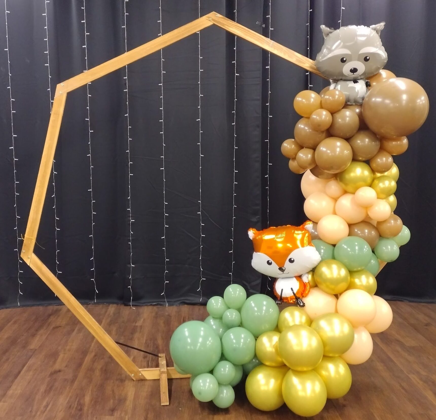 Balloon Arch featuring woodland theme balloons