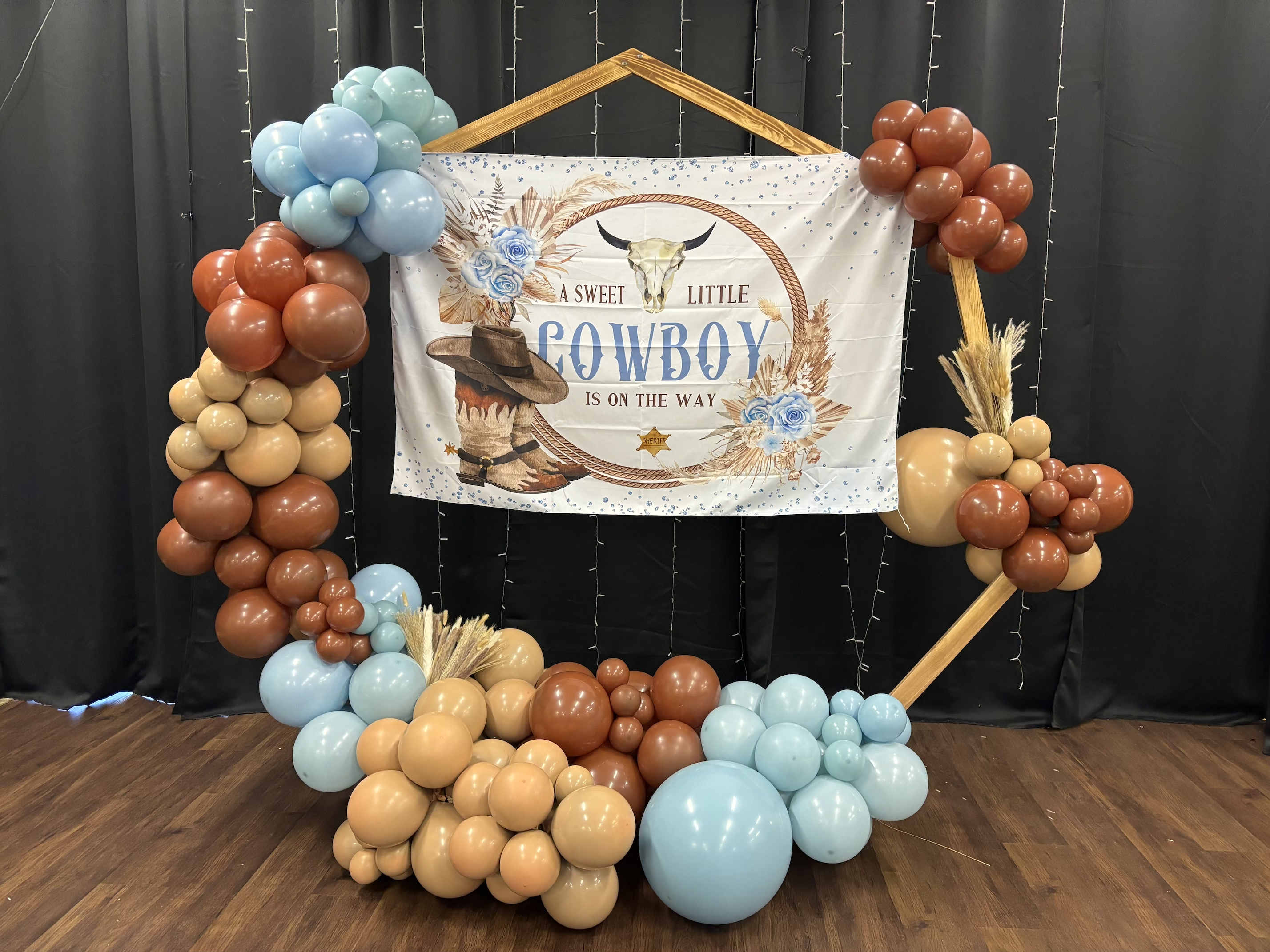 balloon arch arrangement for baby shower little boy colors brown baby blue and nude with a little cowboy is on the way banner in bullhead city FORT MOHAVE arizona