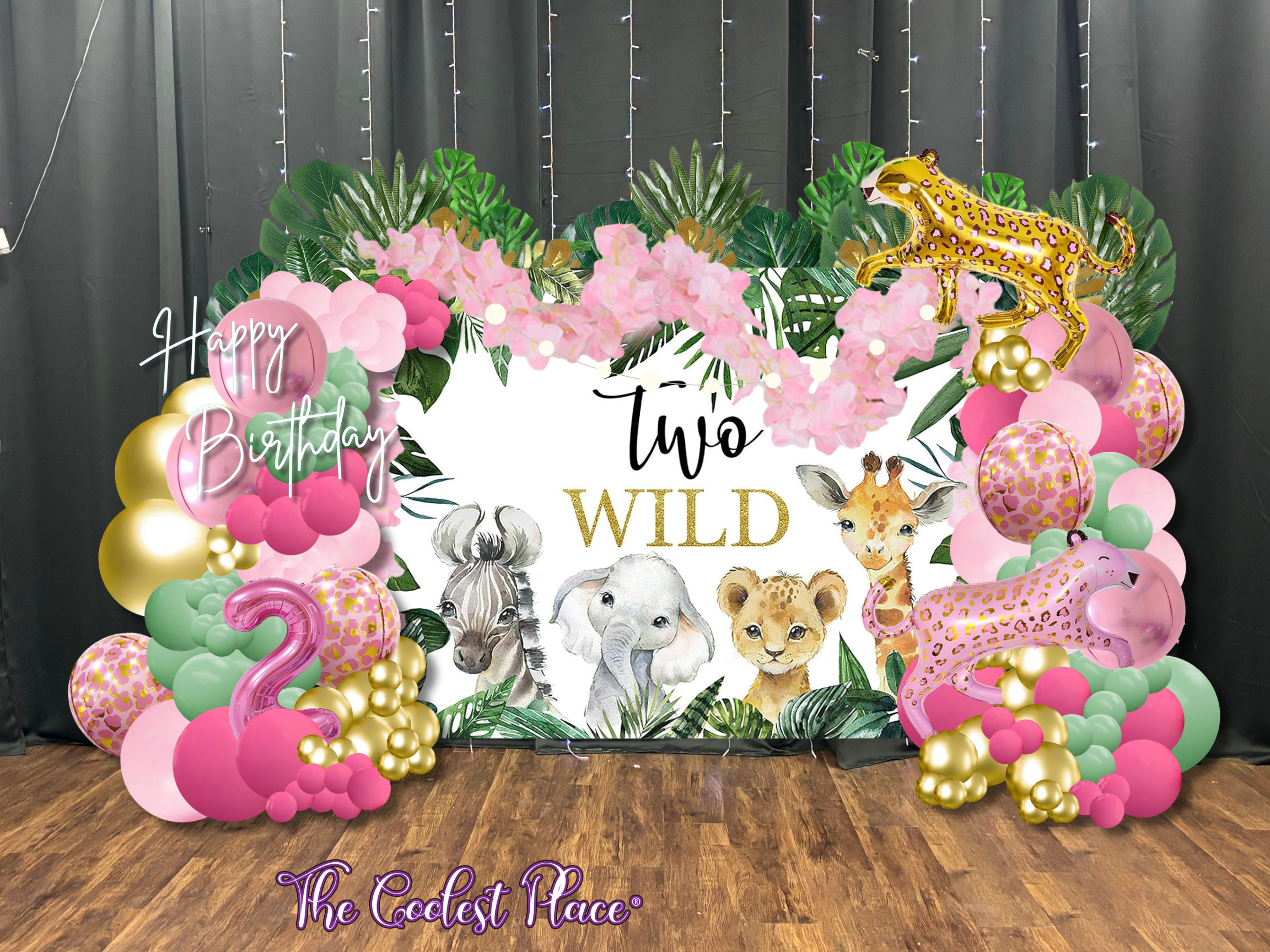 Two Wild Pink Leopard Decor Set with Pink, Green, Gold balloons arranged with palm leaves